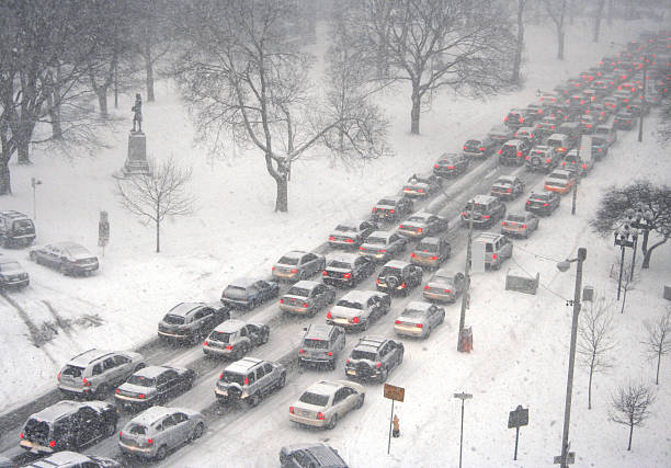 Traffic jam in a blizzard Cars have to slow down when the winter weather turns nasty. blizzard photos stock pictures, royalty-free photos & images
