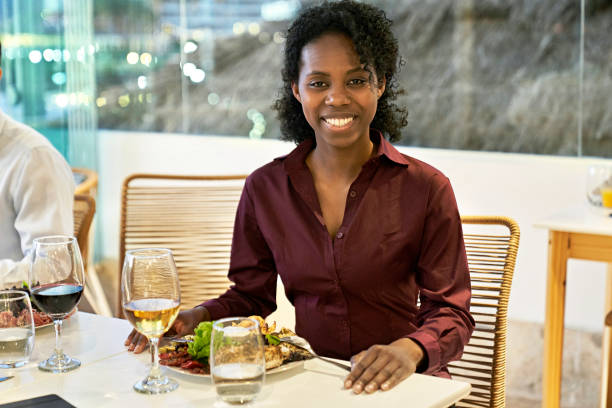 istock Cheerful Black executive enjoying business dinner 1449550234
