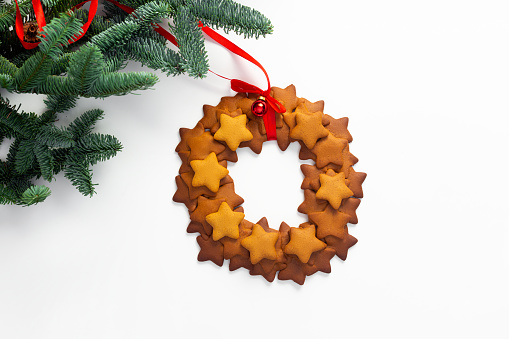 gingerbread christmas wreath and fir on white background