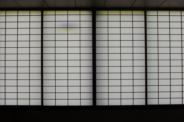 istock Rectangular and square Japanese shoji paper window frame with partitions with light in Japan 1449551828