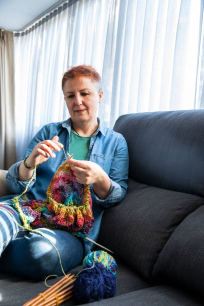 istock Mature Woman Knitting Wool 1449551856