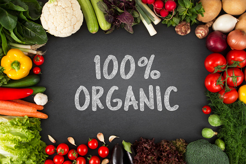 Fresh and organic vegetables with 100% organic sign