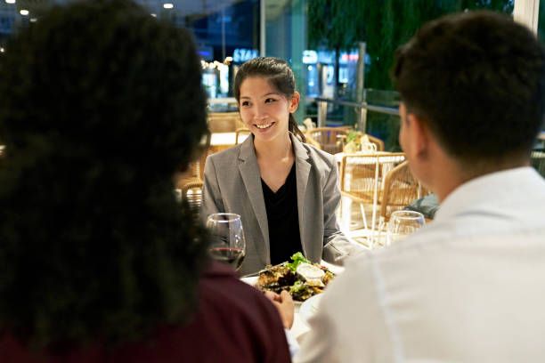 istock Young executives enjoying business dinner at restaurant 1449553020