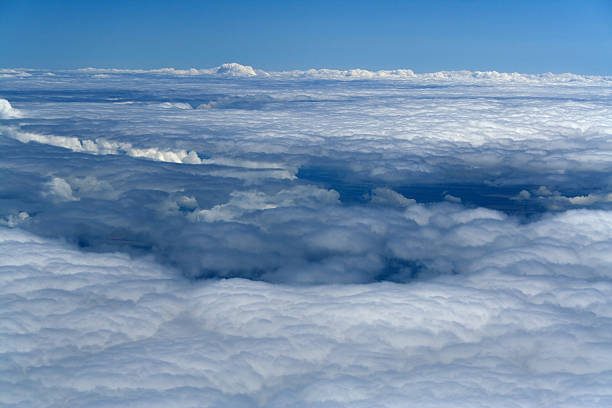 white snow plain of clouds white snow plain of clouds - cloudscape within high blue sky below feet mickey mantle stock pictures, royalty-free photos & images