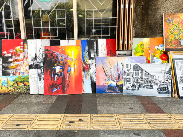 Jalan Braga (Braga Street) in Bandung City, West Java, Indonesia. There are many shops selling paintings on sidewalk of Jalan Braga.