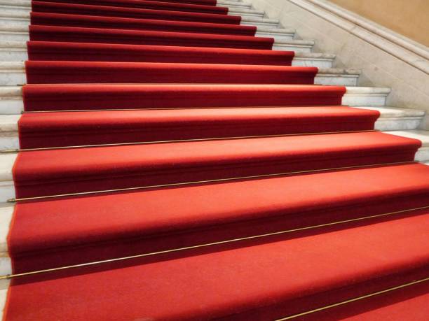 istock Classic elegant marble staircase with a red carpet 1449554286