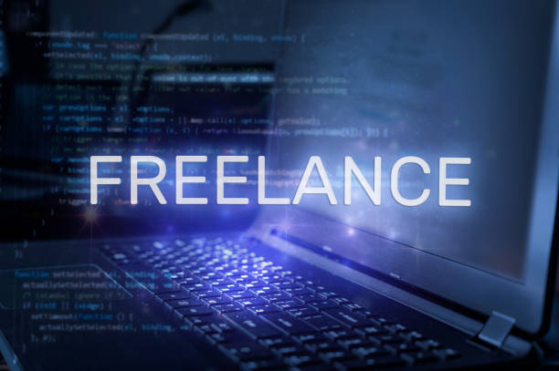 istock Freelance inscription against laptop and code background. Technology concept. 1449555919