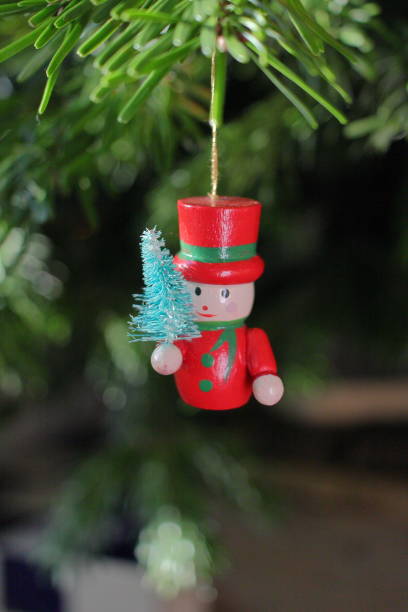 istock A Christmas ornament holding a Christmas tree 1449558772