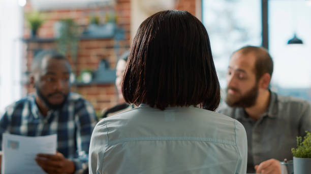 istock Back view of african american candidate attending job interview 1449558832