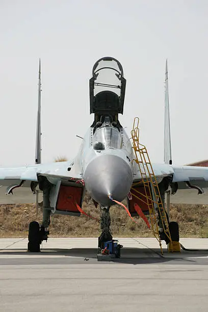 A powerful Soviet-era jet fighter ready for inspection.