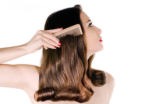 Woman with shiny brown hair on white
