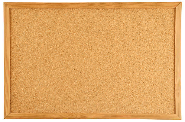 A brown cork bulletin board with a wooden frame An empty cork bulletin or message board. bulletin board stock pictures, royalty-free photos & images