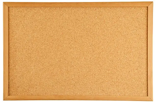 Photo of A brown cork bulletin board with a wooden frame