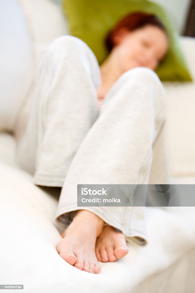 Woman relaxing Woman relaxing on the couch Adult Stock Photo