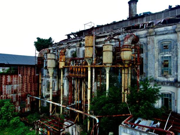 istock Old abandoned factory isolated against the sunny sky 1449570295