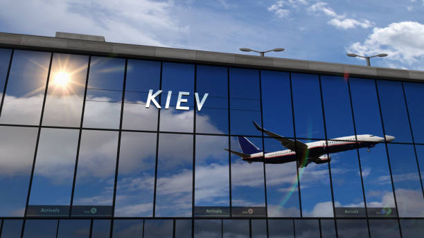 istock Airplane landing at Kiev Ukraine mirrored in terminal 1449571825