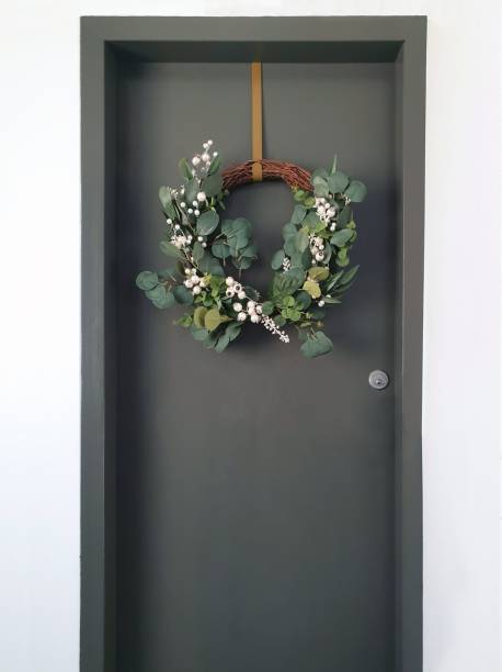 istock Christmas wreath hanging on front door 1449572523
