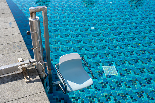 swimming pool lift designed for walking disabled people