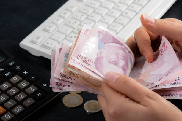 istock Female hands counting money 1449572939