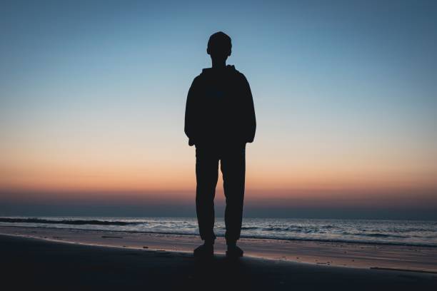 istock Sunrise Silhouette at Beach 1449574031