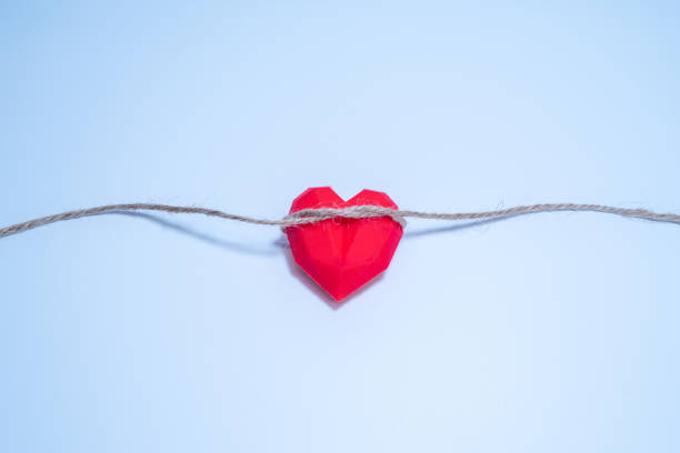 istock Heart shape with rope on white background 1449576893