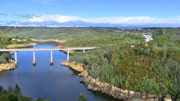 istock Calm river under a bridge on a sunny day 1449578101