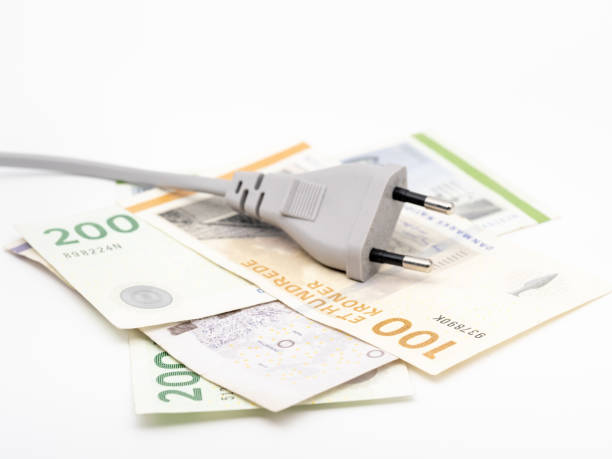 istock a power plug on some danish banknotes on a white background 1449578945