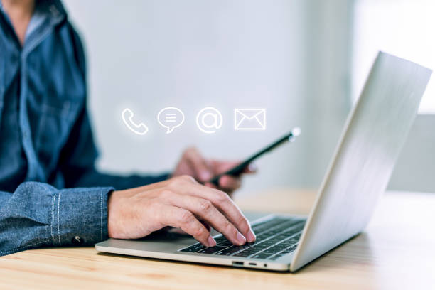 istock Hotline service, Customer support hotline Contact us people connection. Businessman using Smart Phone with the email, call phone, address, Chat message icons 1449580218