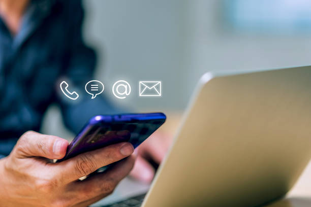 istock Hotline service, Customer support hotline Contact us people connection. Businessman using Smart Phone with the email, call phone, address, Chat message icons 1449580222