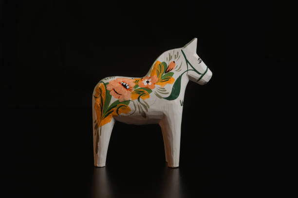 istock Black toy horse isolated on black background 1449582077