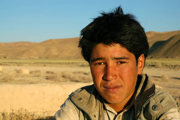 A young man near the town of Dowlatyar in Central Afghanistan stock photo