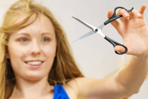 istock Woman with scissors ready to hair cutting 1449583726