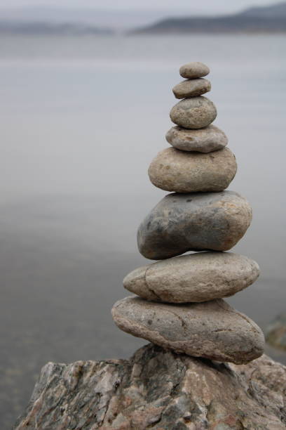 istock stack of stones on the beach. Various stones top view on the beach. Stone Tower, Land Art, Installation, Stones. stones in balance. Mindfulness themed photo. 1449585207