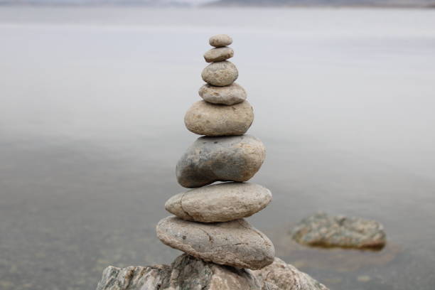 istock stack of stones on the beach. Various stones top view on the beach. Stone Tower, Land Art, Installation, Stones. stones in balance. Mindfulness themed photo. 1449585232
