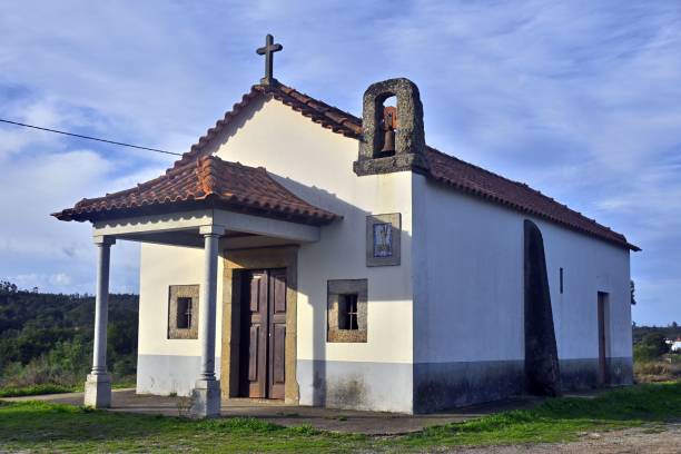 istock Beautiful white chapel isolated against the blue sky 1449585667