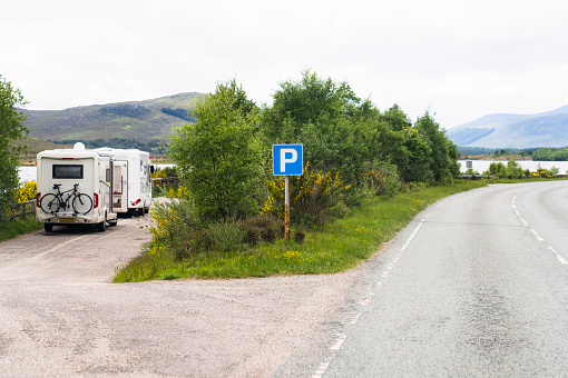 Caravans in a large off-the-road layby in Wester Ross, in the Highlands of Scotland.