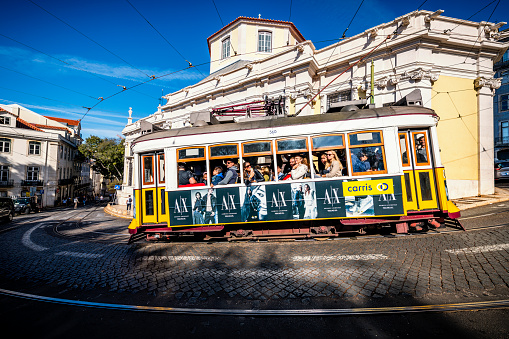 Lisbon, Portugal - November 01, 2022: yellow tram in the streets of Lisbon