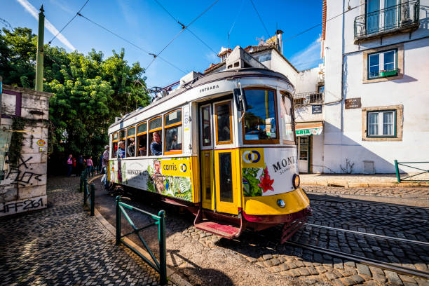 Lisbon, Portugal - November 01, 2022: yellow tram in the streets of Lisbon