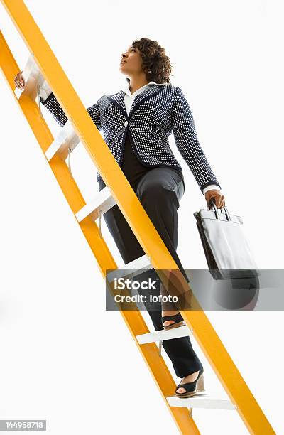 Businesswoman Climbing Ladder Stock Photo - Download Image Now - Ladder, Climbing, Ladder of Success