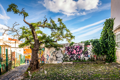 Lisbon, Portugal - November 01, 2022: colorful grafitti in a backyard in Lisbon