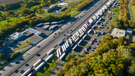 Traffic on highway and rest area. Drone point of view