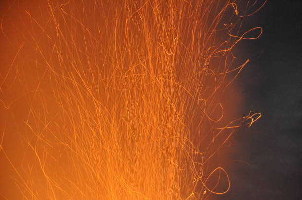 Abstract image of sparks floating up from a bonfire