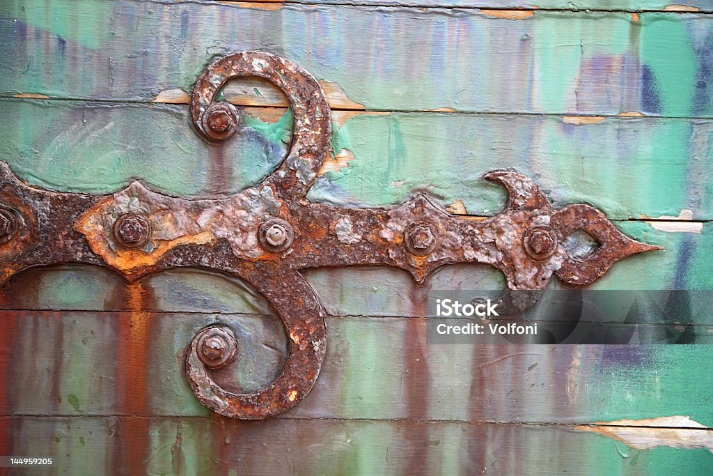 Rusty hinge on wooden door Ancient Stock Photo