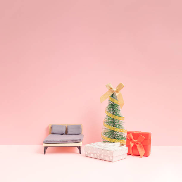 istock Minimal Winter Holidays composition with Christmas treee and gift boxes in the bedroom. 1449592667