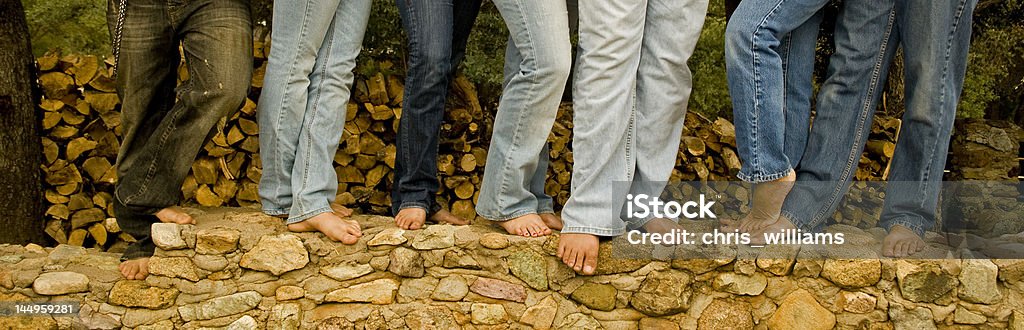 blue jean generations family playing around on a stone wall...if you use this photo i would love to know about it! Family with Four Children Stock Photo