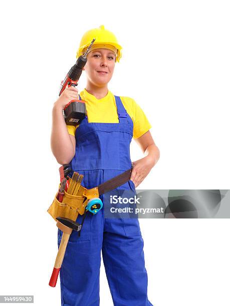 Foto de Fêmea Com Driller Builder e mais fotos de stock de Acessório - Acessório, Amarelo, Artigo de vestuário para cabeça