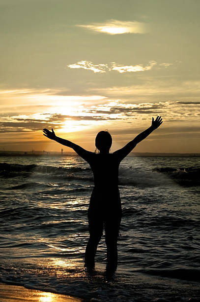 istock worshipper against incredible summer sunset 144959464