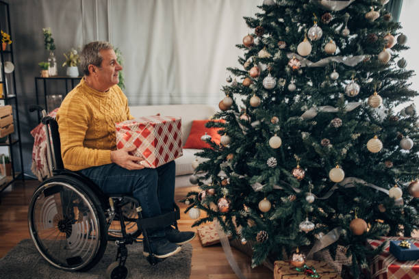 istock A disabled senior decorates the Christmas tree 1449594652
