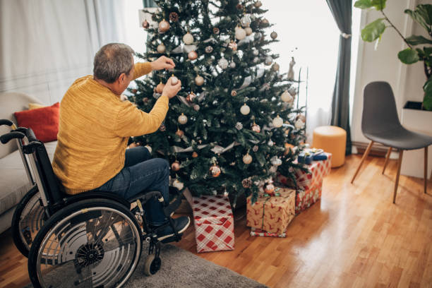 istock A disabled senior decorates the Christmas tree 1449594690
