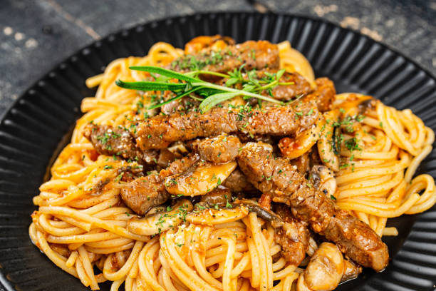 istock Pasta with Beef Tenderloin and Mushrooms 1449595916